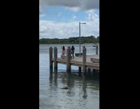 Woman Poses Overlooking Lake 