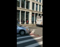 Woman red dress photo shoot sidewalk bus