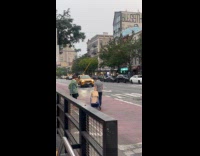 Man begging money using pole with cup