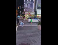 Woman green coat on pedestrian times square