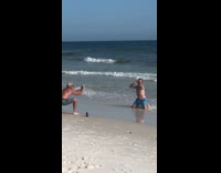 Two men imitate women tiktok video shoot beach