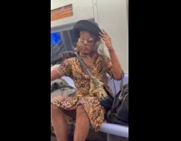 Person wears creepy costume in subway ride