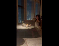 Woman white dress poses beside their food