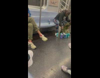 Guy puts drink cans into bag 