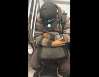 Guy wears an electronic screen hat that says Wake me up before I go go... Past 34th street