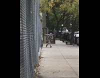 Guy walks crosses legs does prayer sidewalk 