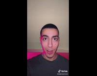 Guy winks and glitches wears pink wig 