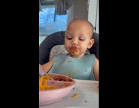 Sleepy baby falls asleep while eating lunch