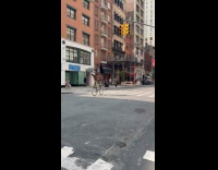 Man gray shirt ride tall bike street