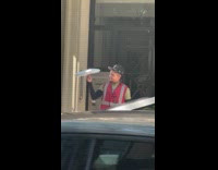 Delivery driver spinning package on finger 