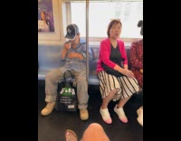 Old man picks nose hair on subway