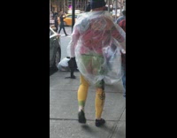 Nude man with painted body walks down sidewalk and greets pedestrians, Polar Bear Day