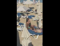 Woman red bikini fishnet dress beach chairs