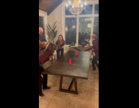 Mother and daughter wrestling for Christmas game