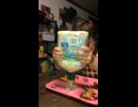 Little girl cusses at ranch bottle getting sauce 