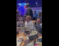 Grandma Wrapped in Tablecloth Looks and Laughs