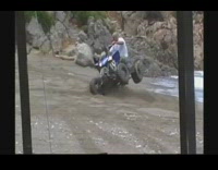Green shorts guy falls off blue ATV 