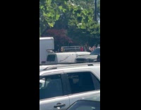 Man shows hearse parked near pride celebration