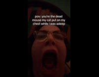 Woman pretends to be shocked by dead mouse