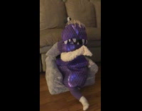 Little baby kid in boo costume watching monsters inc
