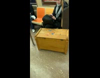 giant wood box man barefoot