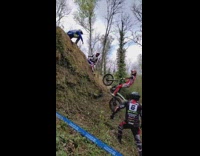 Guy rides green dirt bike up wall fail 