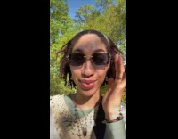 Woman showing off color changing lenses