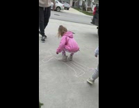 Little girl draws boobs on chalk drawing 