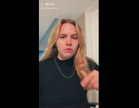 Girl with ring puts finger inside of mouth