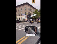 Man on bike with dog on bike trailer