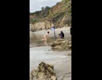 Naked person kneel on sand photo shoot
