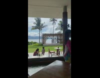 Woman ballet jump shot striped wood pavilion