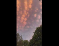 Round cloud formation in the orange sky