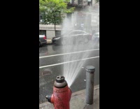 Street car wash from broken fire hydrant