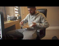 Guy eats spaghetti out of glass container to get stronger