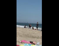 Blue bikini girl sits beach sand pt. 2
