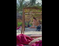 Two girls bikini drink under tree leaves