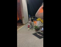 Influencer event taking picture on private jet hangar 