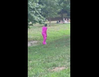 Man pink bodysuit ride OneWheel board park