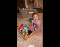 Kid puts cat under pile of toys 