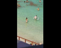 Collab IITW - Lady take picture with the guy on the beach