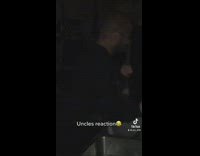 Two guys blow out fire on fingers