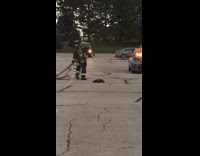 Firefighters extinguish car fire parking lot 
