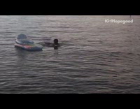 Guy struggles to climb blue inflatable float