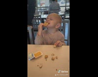 Boy eats food and loves the taste