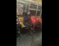 Guy sits next to fire on train 