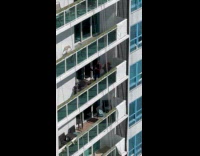 Man play saxophone Let It Be balcony