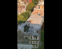 Guys on rooftop throw stuff as game