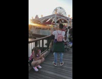 Guy pink backpack yellow  ice cream photo disneyland