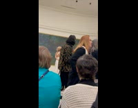 Collab IITW - Woman in white dress poses in front of the art painting